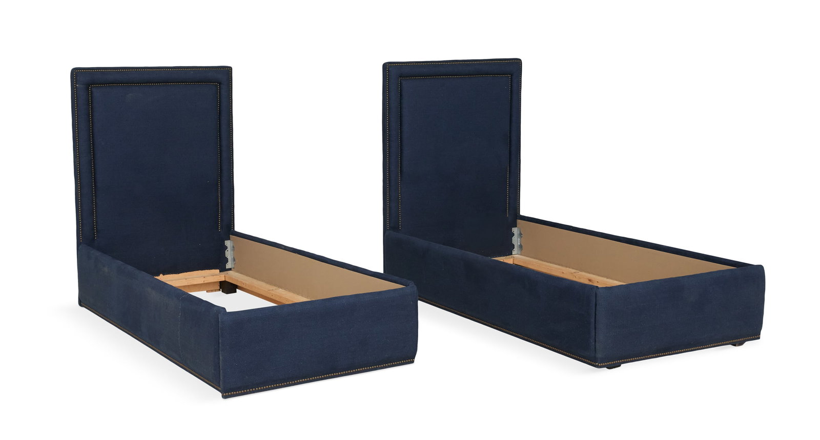 Pair of Contemporary Linen-Upholstered Twin Beds: Pair of Contemporary Linen-Upholstered Twin Beds the navy linen beds with padded headboards trimmed with a double row of brass tacks, with like-covered rails and footboards. h. 55", inside w. 32", l. 