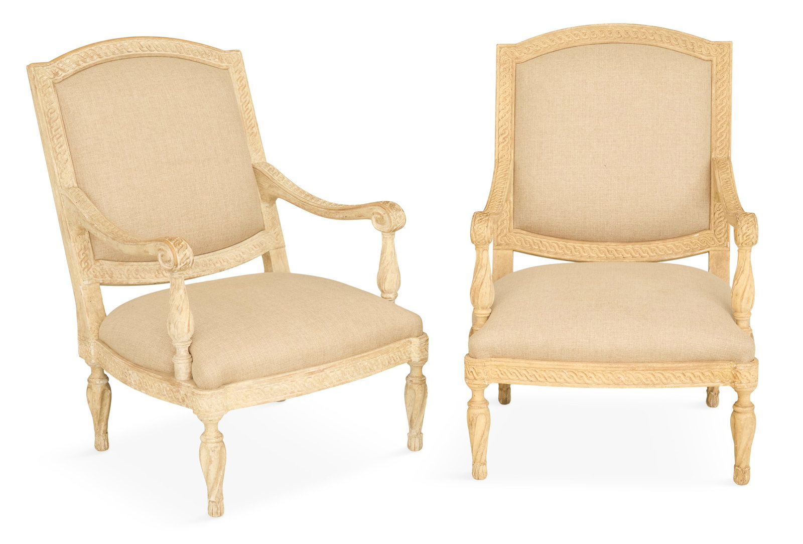 Pair of Large Creme-Peinte Fauteuils: Pair of Large Creme-Peinte Fauteuils in the Louis XVI taste, each with a padded back and seat, guilloche-carved frame and like-carved downswept arms, raised on bulbous spiral-turned legs, attributed