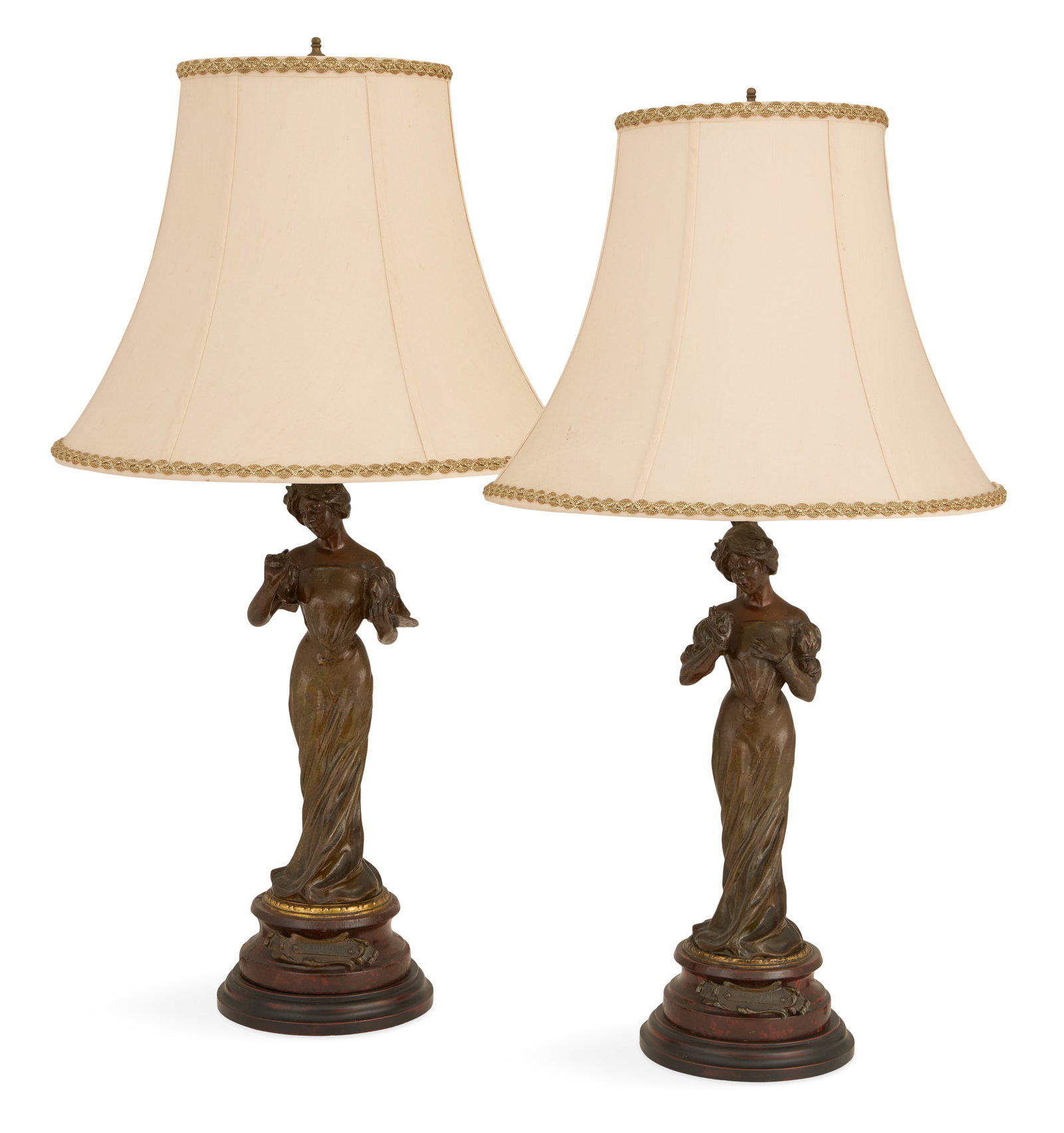 Pair of French Art Nouveau Patinated Metal Lamps: Pair of French Art Nouveau Patinated Metal Lamps ca. 1900 and later, each with a female figure in fin-de-siecle attire, one holding a piece of fruit and labeled on the rouge griotte marble base "LeGou
