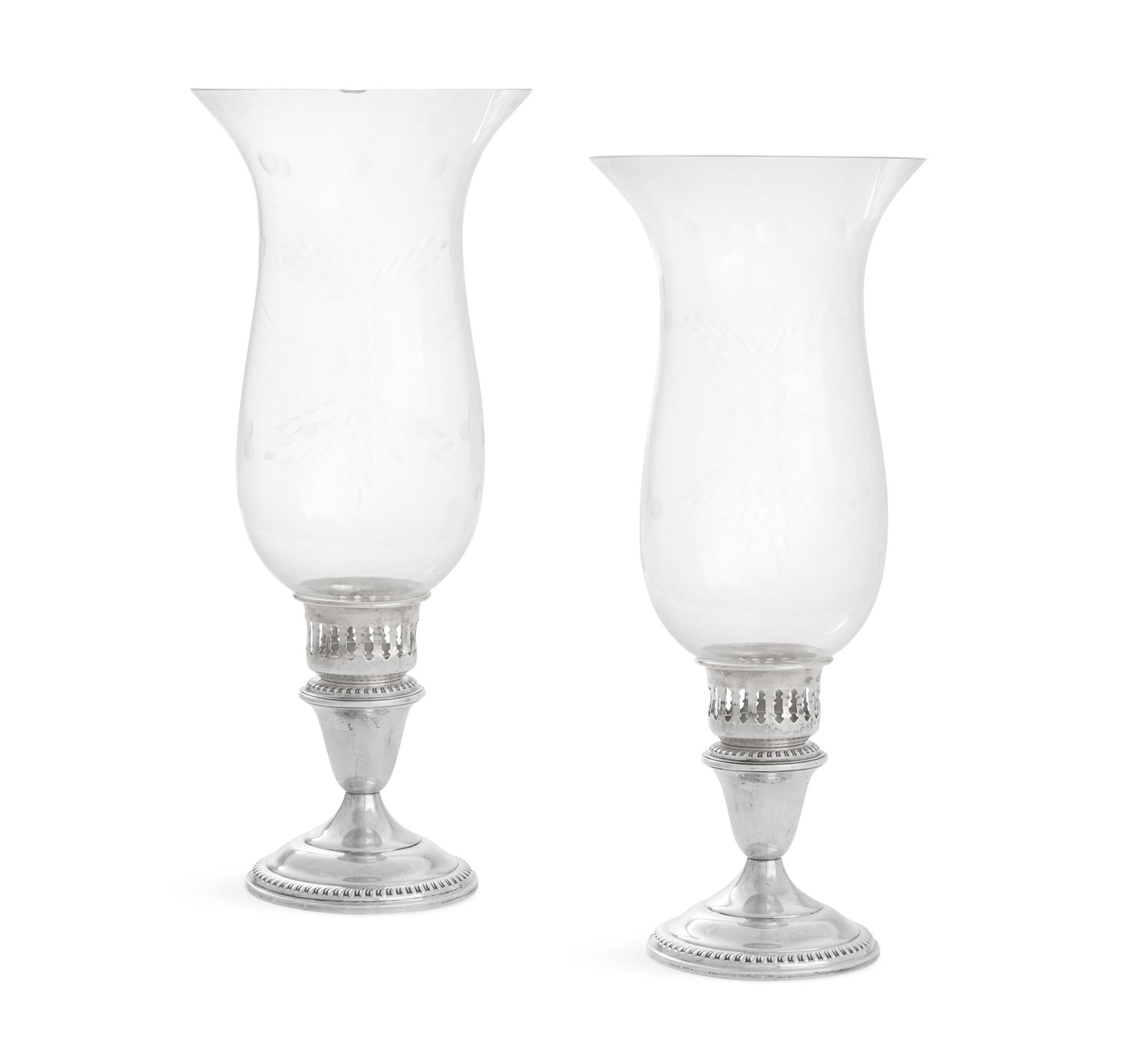 Pair of Sterling Hurricane Lamp Candlestands: Pair of Sterling Silver Hurricane Lamp Candlestands mid-20th century, Empire Silver Co., Brooklyn, New York, each with an inverted bell-form nozzle surrounded by a reticulated shade holder and raised 
