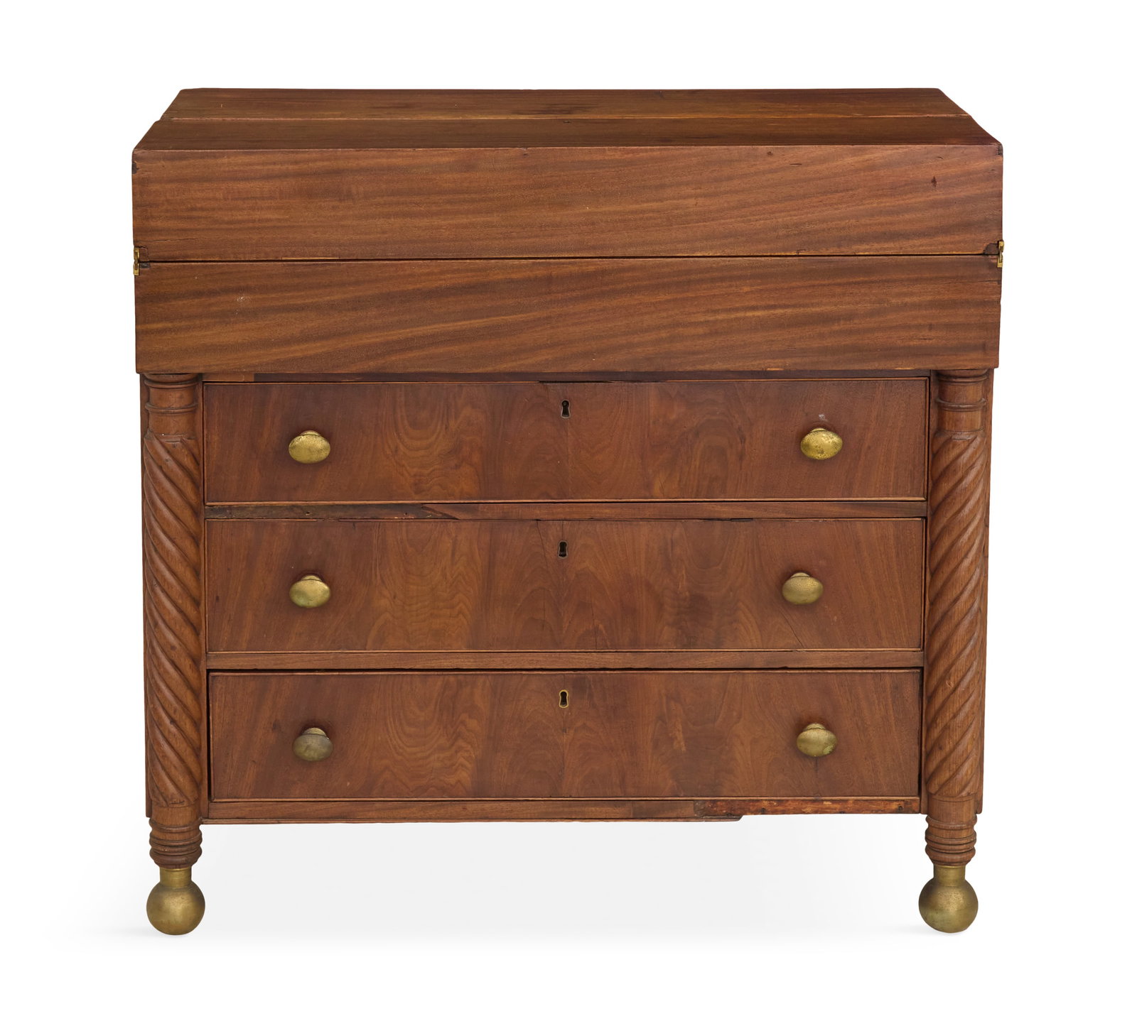 American Late Classical Mahogany Butler's Chest: American Late Classical Mahogany Butler's Chest 19th century, the top with a fold-open writing desk over three long graduated drawers, flanked by spiral-turned columns and ending in brass ball feet. h