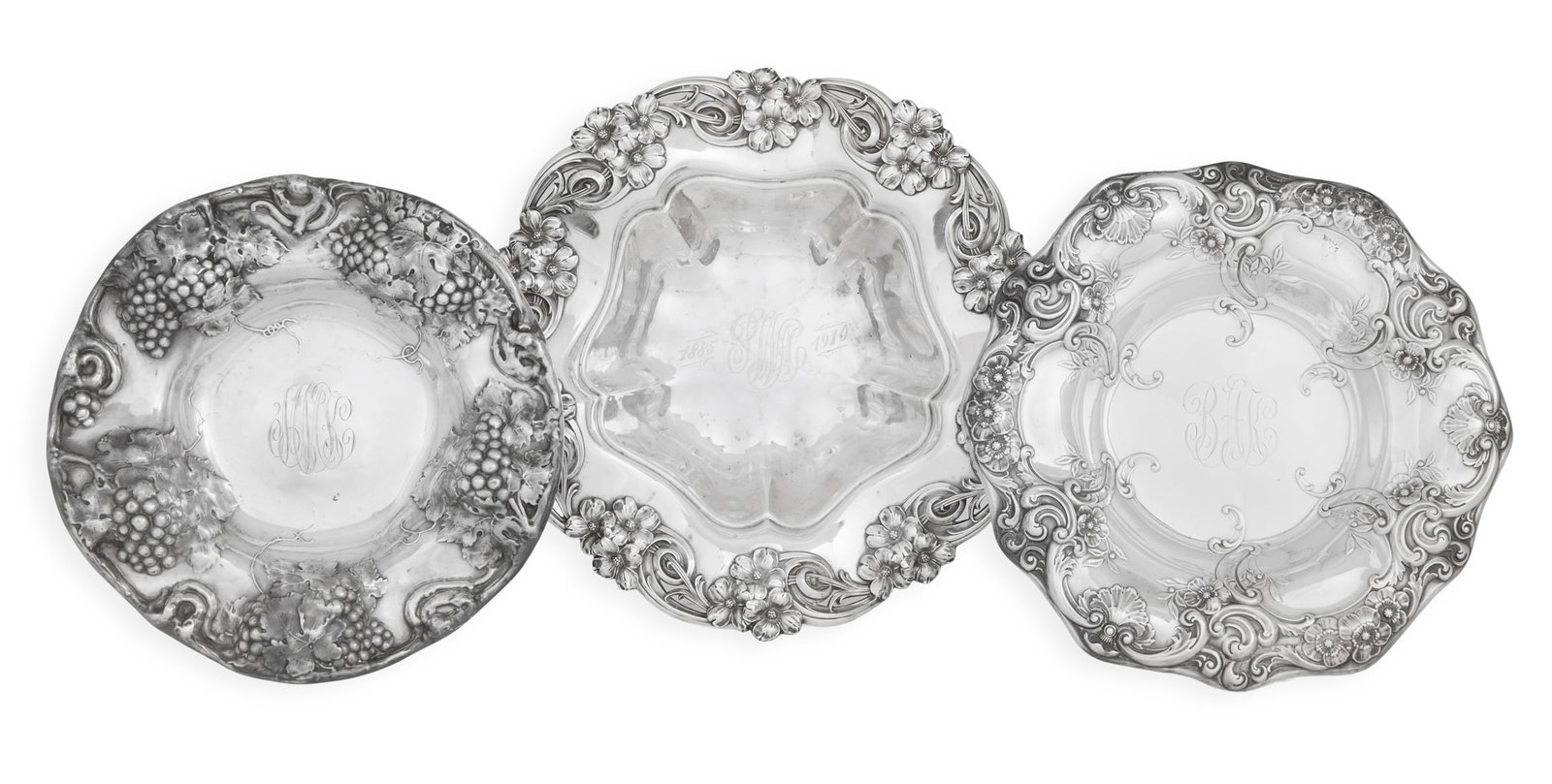 Three American Sterling Silver Fruit Bowls: Three American Sterling Silver Fruit Bowls first quarter 20th century, all deeply embossed, including: a Simpson, Hall & Miller example decorated with grape clusters, monogrammed "MKM", dia. 11"; a Go