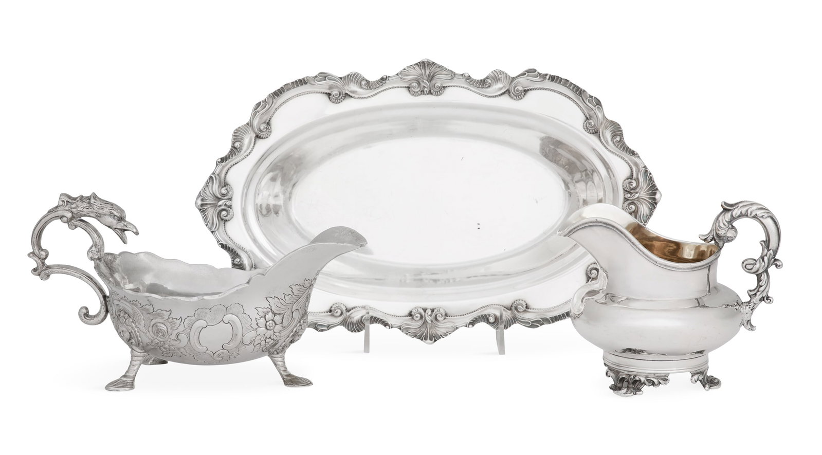 Three Pieces of Silverplate Tableware: Three Pieces of Rococo-Style Silverplate Tableware 20th century, including: a Wallace "Chippendale" bread tray, 12-3/4" x 7-1/2"; a Corbell & Co. sauceboat with extravagant rococo decoration and eagle