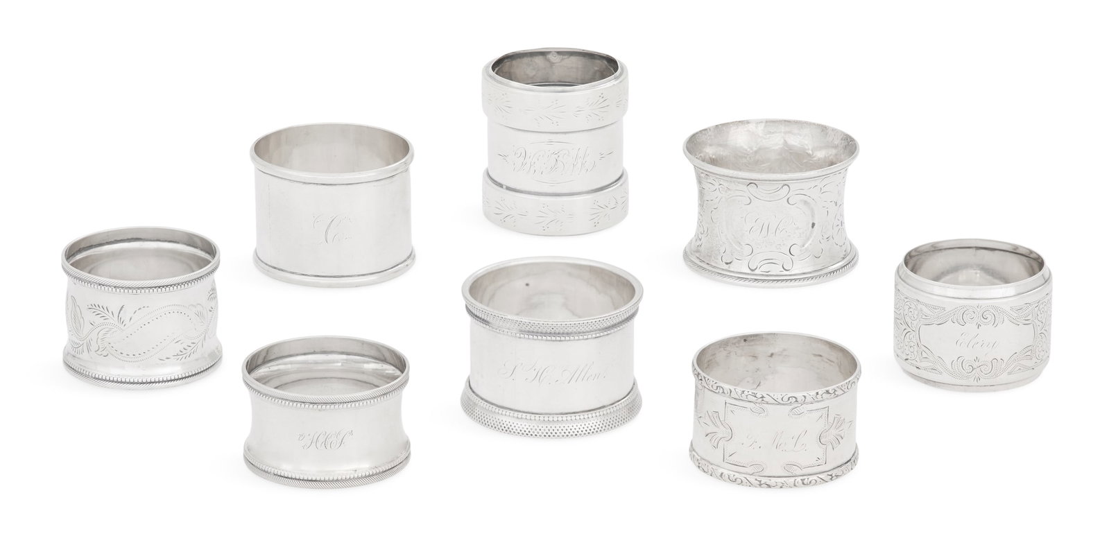 Eight American Silver Napkin Rings: Eight American Silver Napkin Rings late 19th/early 20th century, unmarked, all circular, including: one embossed with wide frieze rim decorated with bright-cut flowers, monogrammed "WBM", h. 1-7/8", d
