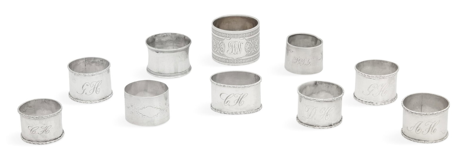 Collection of Ten Silver Napkin Rings: Collection of Ten Silver Napkin Rings first half 20th century, including: four sterling, Mexico, cylindrical with applied edge, monogrammed "AH", "GH" (2) and "DH", h. 1-1/4", dia. 1-3/4"; one sterlin