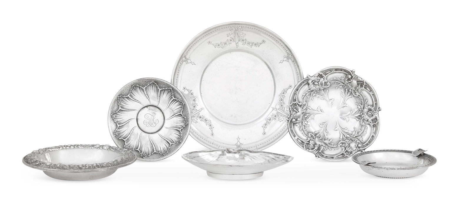 Six American Small Sterling Silver Dishes: Six American Small Sterling Silver Dishes 20th century, including: an S. Kirk & Son "Repousse" bottle coaster, dia. 6-1/4"; a Whiting small plate, 1914, with floral garland decoration, dia. 7-7/8"; a 