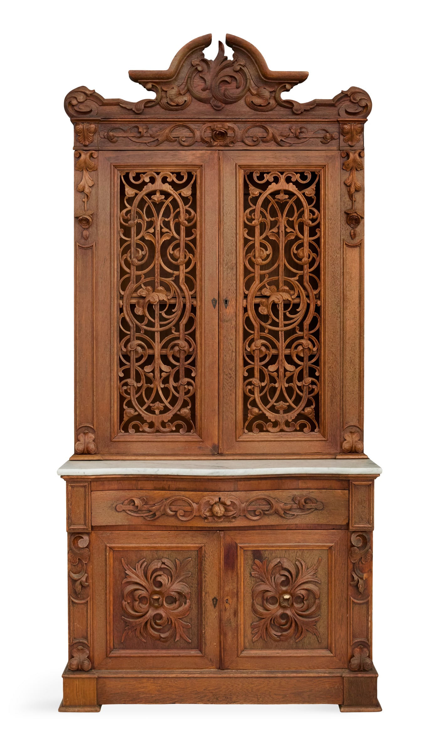 American Rococo Revival Carved Oak Secretary: American Rococo Revival Carved Oak Secretary third quarter 19th century, attributed to Mitchell and Rammelsberg, Cincinnati, Ohio, the upper case with a crest over a pair of doors with pierced and car