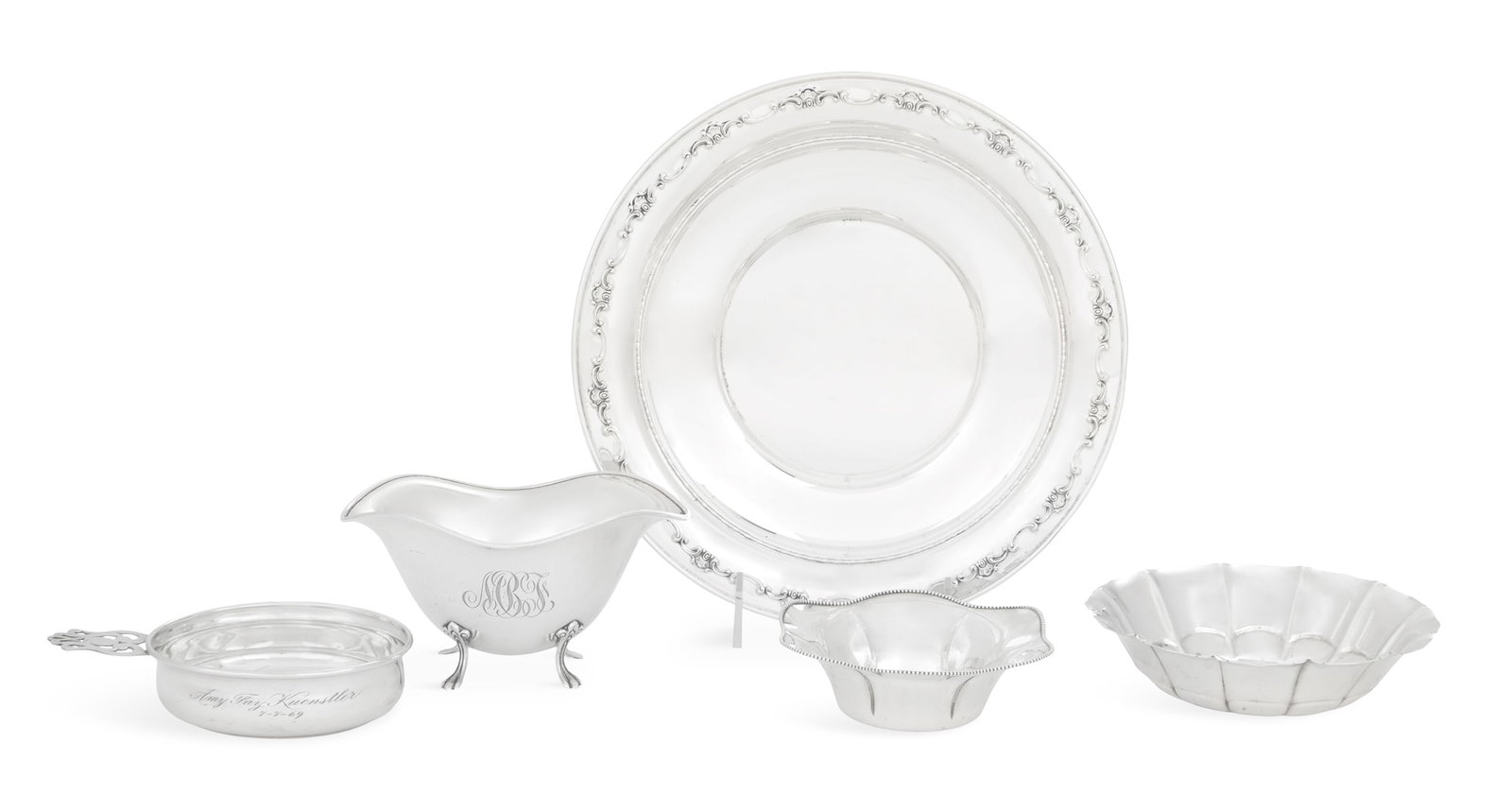 American Sterling Silver Small Tableware: Five Pieces of American Sterling Silver Small Tableware mid-20th century, including: a Simpson, Hall & Miller circular condiment dish with beaded wavy rim, dia. 4-3/4"; a Towle sauceboat with wavy rim