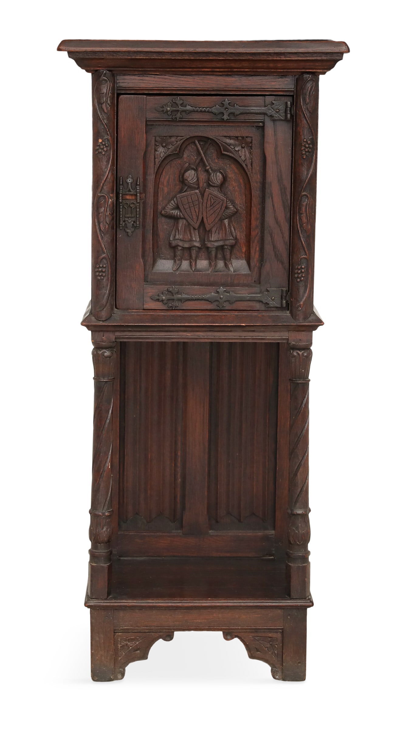 English Carved Oak Cupboard: English Carved Oak Cupboard early 20th century, the molded cornice above a case fitted with a single cupboard door, inset with a panel of two carved knights, the sides with linen-fold paneling, joined
