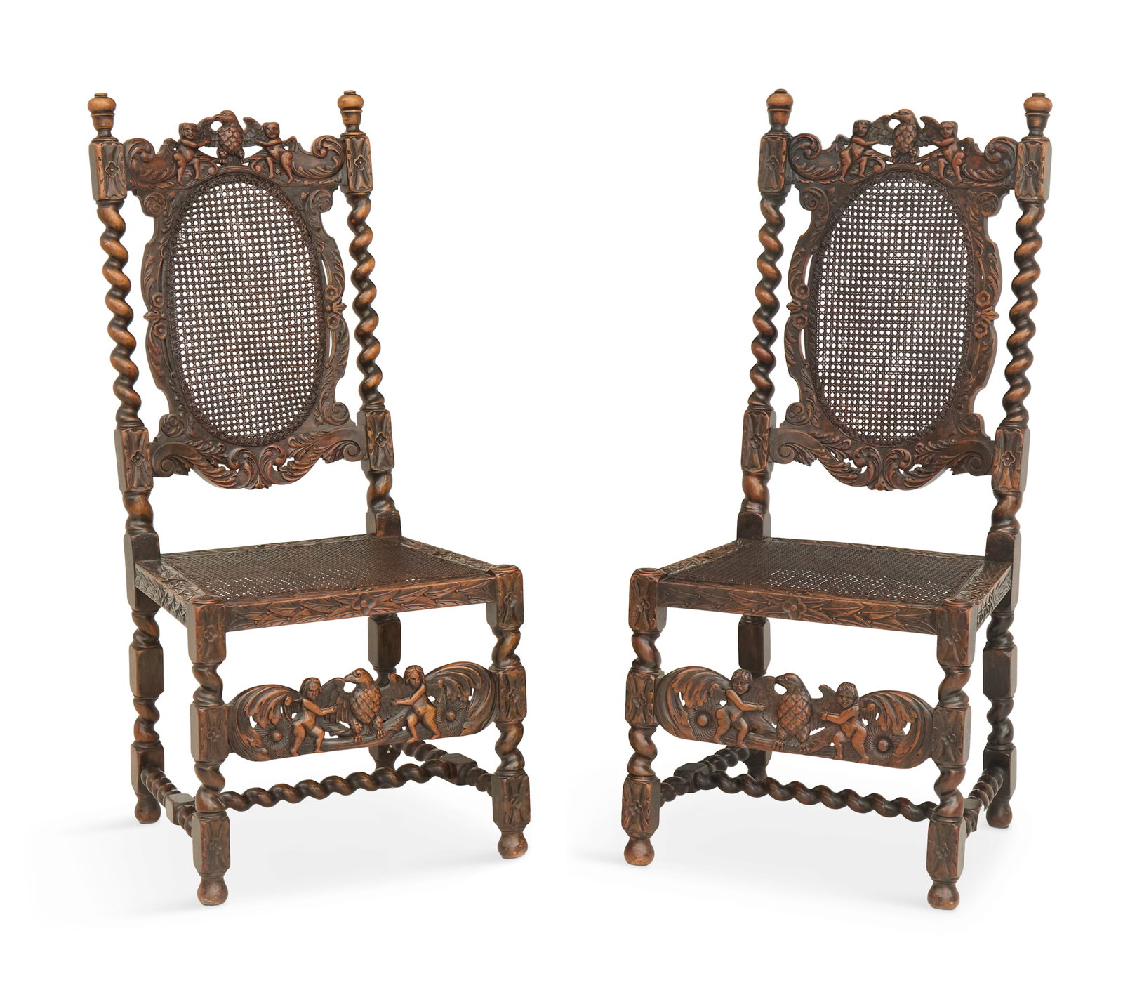 Charles II-Style Walnut and Caned Side Chairs: Pair of Charles II-Style Walnut and Caned Side Chairs 19th century, each with cherub- and eagle-carved crest rails and front stretchers, barley-twist frames and caned seats and backs. h. 45-1/2", w. 2
