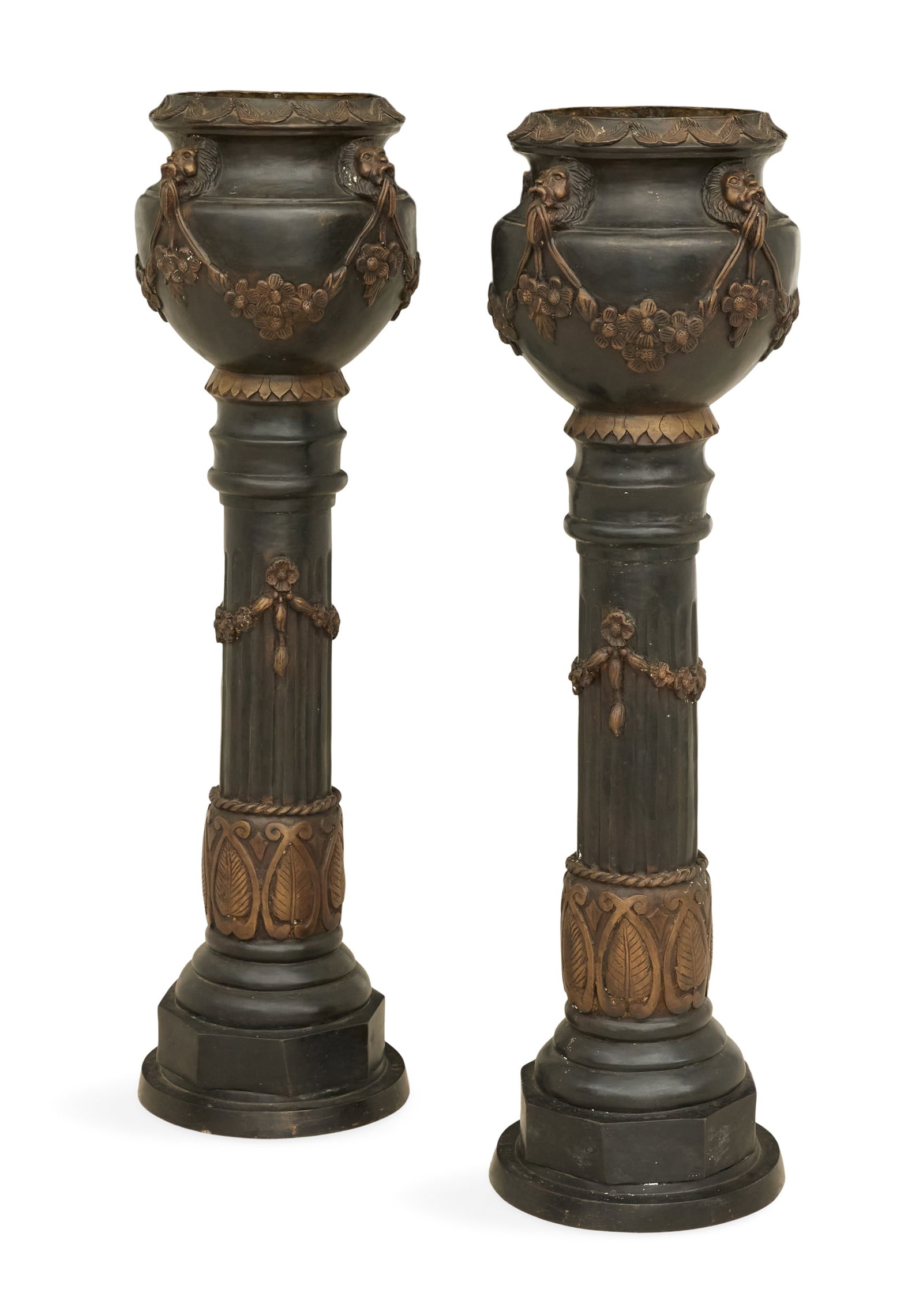 Pair of Bronze Planters: Pair of Bronze Planters contemporary, the leaf-molded rims over the ovoid bodies, decorated with lion's heads supporting swags of flowers, on fluted column-form bases molded with swags of flowers. h. 