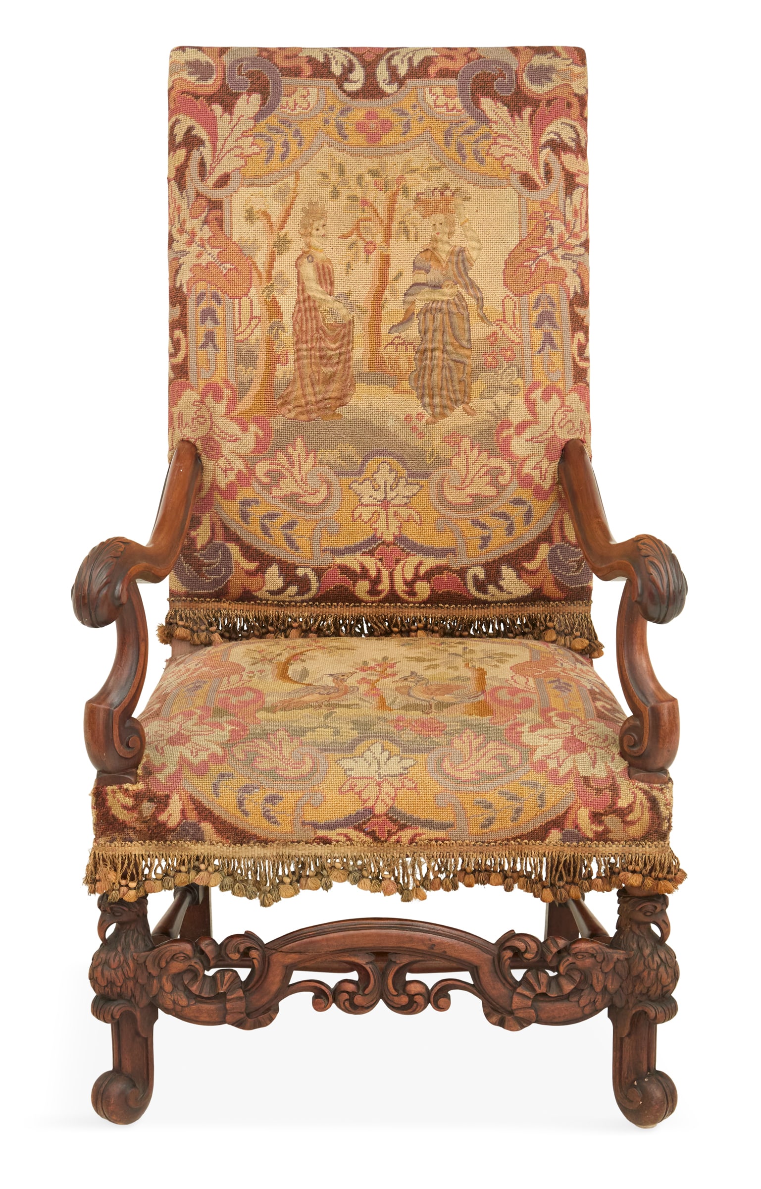 Carolean-Style Walnut Armchair: Carolean-Style Walnut Armchair ca. 1900, the tall, padded back covered in period needlepoint, and the seat covered in like needlepoint, raised on eagle-carved legs joined by a pierced and carved front