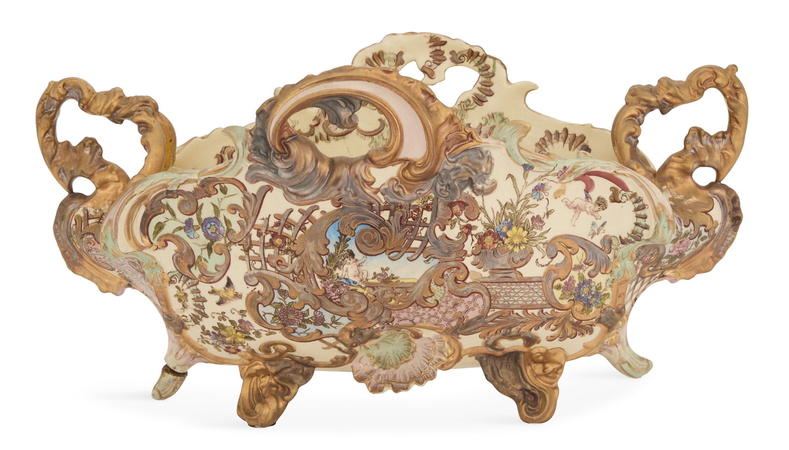 Hungarian Fischer J. Pottery Centerpiece: Hungarian Fischer J. Pottery Centerpiece late 19th century, Budapest, richly decorated with pierced gilt and silver-gilt scrollwork and shells, and painted with flowers and putti, with a brown transfe