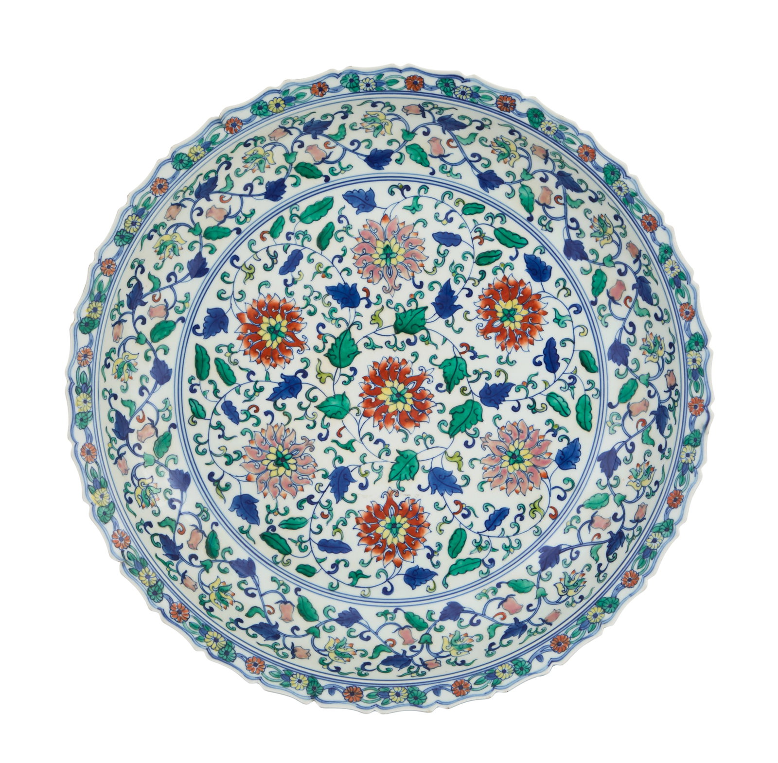 Large Chinese Wucai Porcelain Foliate Saucer Dish: Large Chinese Wucai Porcelain Foliate Saucer Dish Republic Period (1908-1949), the basin-shaped saucer dish with a foliate lip rim decorated in underglaze blue and yingcai enamels with lotus, scrollin