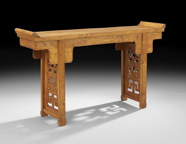 Chinese Elm Altar Table: Chinese Elm Altar Table, the rectangular top with raised ends above a shaped frieze, raised on pierced end supports ending in carved feet, h. 35-1/2", w. 65", d. 16".