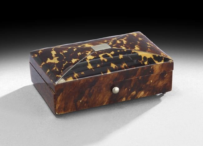 Edwardian Tortoiseshell Jewel Box: Edwardian Tortoiseshell Jewel Box, first quarter 20th century, the segmented lid set with a nickel plaque for initials, h. 1-1/4", w. 4-1/4", d. 2-1/2".