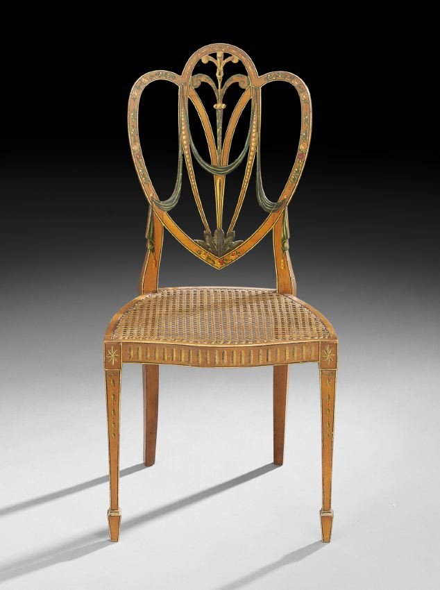 Edwardian Polychromed Satinwood Sidechair: Edwardian Polychromed Satinwood Sidechair in the Hepplewhite Taste, first quarter 19th century, the back of shield form with Prince of Wales plumes and foliate and floral marquetry, the caned seat wit