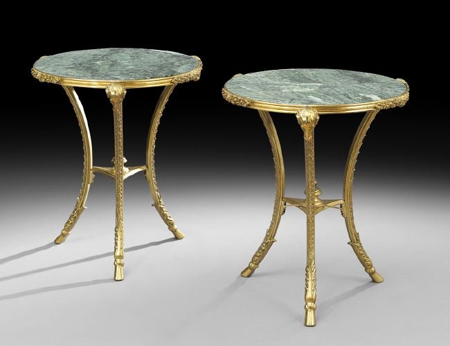 Pair of French Marble-Top Gueridons: Pair of French Directoire-Style Gilt-Bronze and Marble-Top Gueridons, set with verde antico marble, the hoof-footed legs terminating in ram's heads, h. 31-1/2", dia. 24".