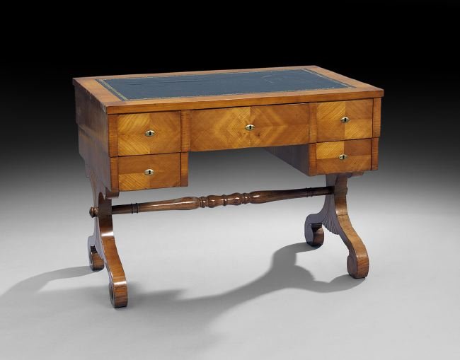 Biedermeier-Style Fruitwood Desk: Biedermeier-Style Fruitwood Desk, early 20th century, the rectangular top with an inset leather writing surface, above a case fitted with a central drawer flanked to either side by two small drawers, 