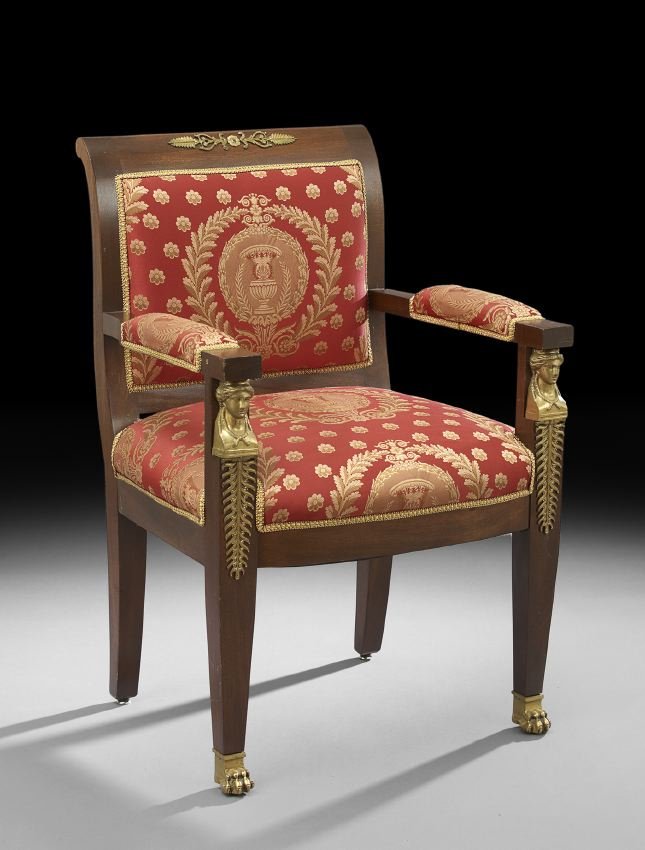 Empire-Style Mahogany Fauteuil: Empire-Style Mahogany Fauteuil, contemporary, the padded back surmounted by a backswept ormolu-mounted crest, and joined to the padded seat by like arms headed by ormolu maiden's heads and ending in p