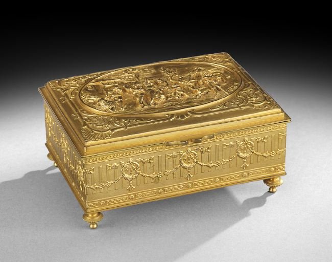 Louis XIV-Style Gilt-Bronze Cigar Box: Louis XIV-Style Gilt-Bronze Cigar Box, second quarter 20th century, decorated with a bas-relief scene on the hinged cover and lined in Spanish cedar, marked "Made in France", h. 2-1/4", w. 5-3/4", d. 