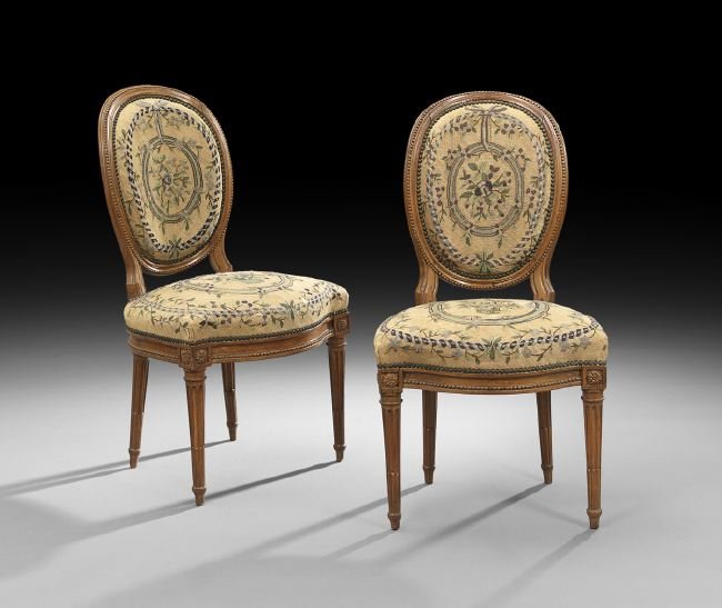 Pair of Louis XVI-Style Beechwood Sidechairs: Pair of Louis XVI-Style Beechwood Sidechairs, ca. 1900, each with a beaded medallion back, serpentine seat, fluted and stop-fluted legs, retaining antique needlepoint upholstery, h. 34-1/2".