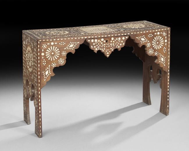 North African Hardwood and Bone-Inlaid Side Table: North African Hardwood and Bone-Inlaid Side Table, late 19th century, the rectangular top above a frieze fitted with a single shaped pendant drawer, raised on shaped end supports, the whole with intri