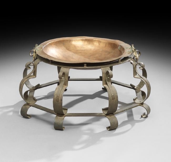 Middle Eastern Copper and Iron Brazier: Middle Eastern Copper and Iron Brazier, the faceted iron base on scroll feet, supporting the flat brazier, mounted with molded brass carrying handles, h. 14", dia. 30-3/4".