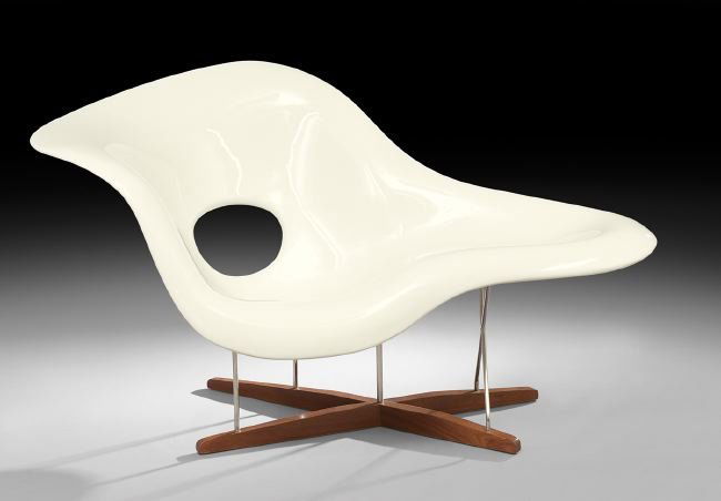 After Charles Eames, "La Chaise": After Charles Eames, "La Chaise", comprised of molded fiberglass, chromed steel and sycamore, h. 33-1/4", w. 39-1/4", d. 34-1/4". The design of this chair was Eames' entry in the 1948 "International C