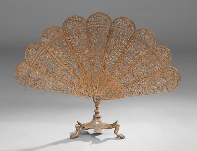 Aesthetic Copper and Steel Fan-Form Fire Fender: Rare Aesthetic Copper and Steel Waisted Fan-Form Fire Fender, fourth quarter 19th century, the tripartite base in the Neo-Grec style, with paw feet trimmed in anthemia, the segmented fans pierced with