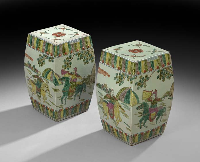 Pair of Chinese Celadon Porcelain Garden Seats: Pair of Chinese Celadon Porcelain Garden Seats, 20th century, decorated with warriors on horseback, h. 17", dia. 11".