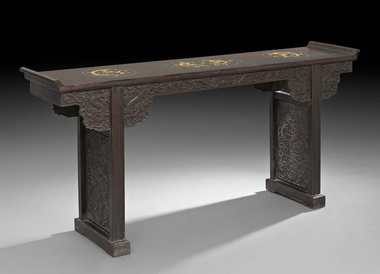 Chinese Carved Rosewood Altar Table: Chinese Carved Rosewood Altar Table, 20th century, the sides and aprons carved in relief with archaic scrolling, the top inlaid with Kuei dragons in mother-of-pearl, h. 34", w. 73-1/2", d. 15-1/2".