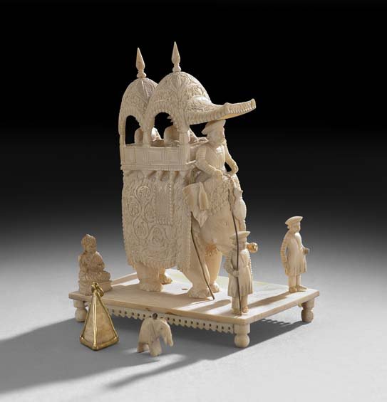 Carved Ivory Elephant Group: Carved Ivory Elephant Group, early 20th century, depicting an elephant sedan on a platform with various carved ivory figures, h. 5-1/2".