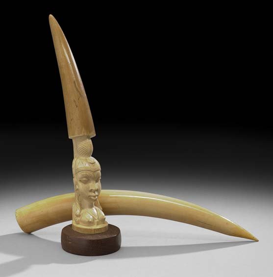 Two African Ivory Tusks: Two African Ivory Tusks, first half 20th century, one carved with a bust of a woman, l. 16".