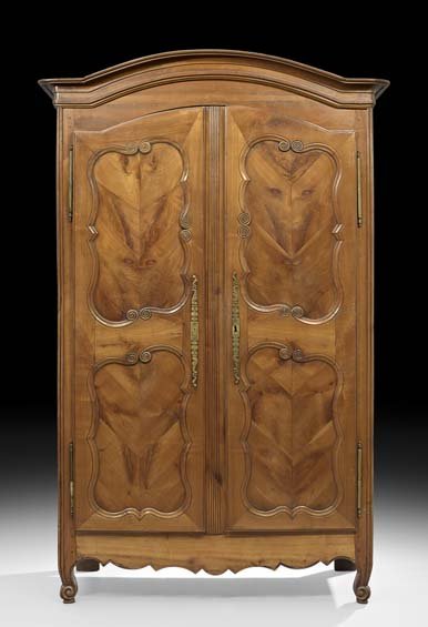 Provincial Louis XV-Style Cherrywood Armoire: Provincial Louis XV-Style Cherrywood Armoire, second quarter 19th century, the molded and domed cornice above a case fitted with two long doors, each inset with two shaped chevron-veneered panels, ove