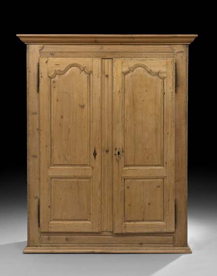 French Provincial Pine Armoire: French Provincial Pine Armoire, mid-19th century, the ogee-molded cornice above a case fitted with two long doors, each bi-paneled and opening to a shelved interior, raised on a molded plinth base, h.