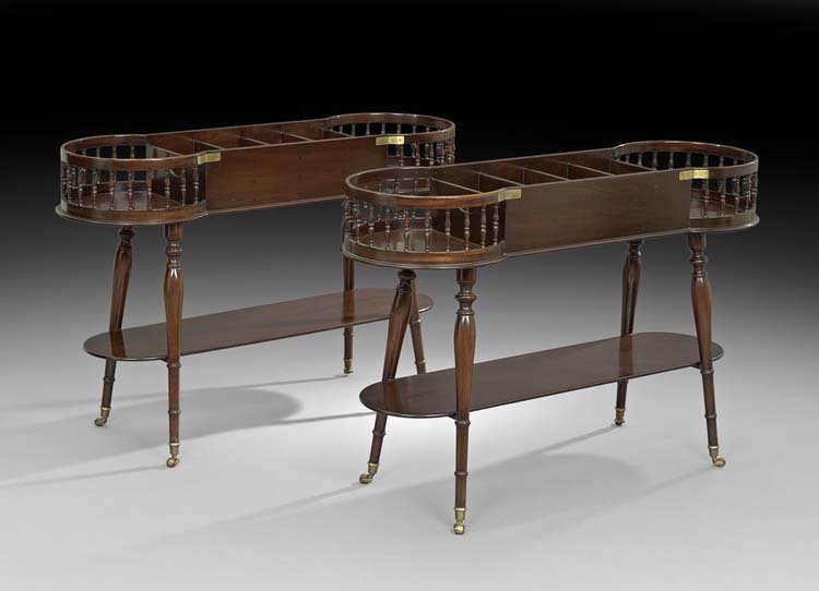 Pair of Edwardian-Style Mahogany Serving Trolleys: Pair of Edwardian-Style Mahogany Serving Trolleys, each with a central compartmented cutlery section flanked to either side by a circular galleried plate caddy, joined by bulbous legs to a lower shelf