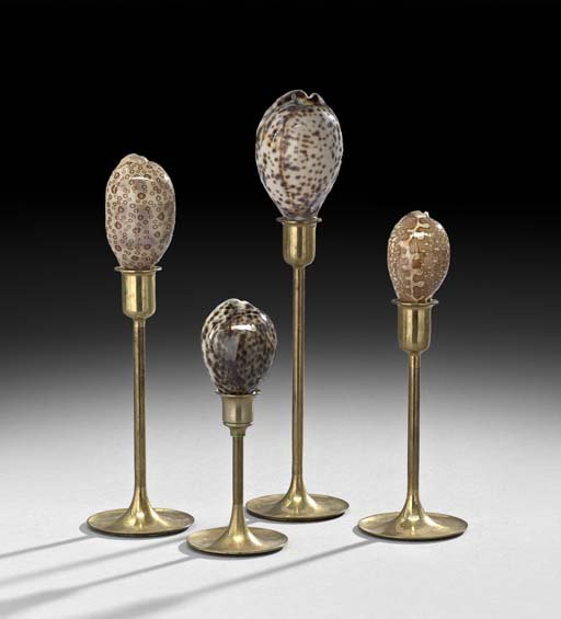 Group of Four Natural Seashells on Brass Stands: Interesting Group of Four Natural Seashells on Brass Stands, composed of four different polished cowrie shells on slender brass stands, h. 6-1/4" to 11-1/4".