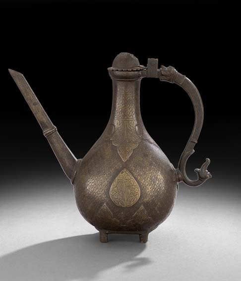 Middle Eastern Bronze Teapot: Middle Eastern Bronze Teapot, with raised pointed arches and incised decoration, the domed cover hinged to the handle, resting on cylindrical feet, h. 9-3/4", w. 10", d. 3-3/4".