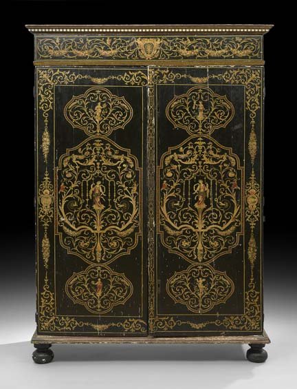 Italian Ebonized Cabinet: Italian Ebonized Cabinet, 19th century, the molded cornice above a case fitted with two long doors opening to a shelved interior, raised on bun feet, the whole elaborately decorated in polychrome scro