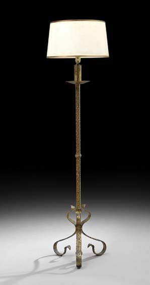 Gilt-Metal Floor Lamp: Gilt-Metal Floor Lamp, in the form of a torchere, the scrolled feet support a square standard fitted with a drip pan, the candle nozzle mounted with an electrified faux wax candle, fitted with a gilt-
