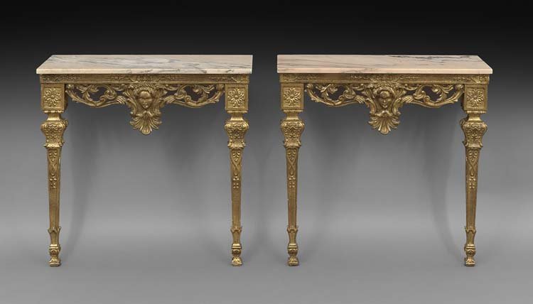 Pair of Italian Marble-Top Console Tables: Pair of Italian Giltwood and Marble-Top Console Tables, early 20th century, each with a rectangular marble top above a conforming frieze with pendant foliate scrolls centering a masque, raised on pane