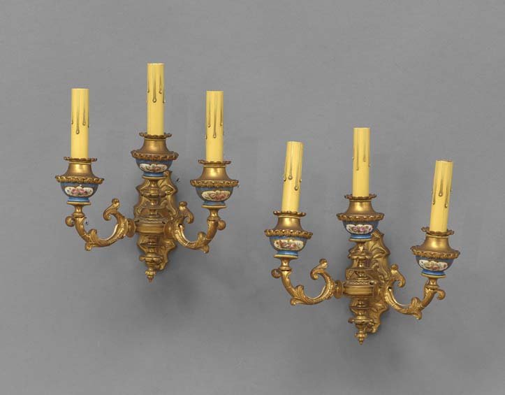 Pair of Napoleon III Porcelain Sconces: Pair of Napoleon III Gilt-Bronze and Porcelain Three-Light Sconces, the Renaissance Revival bronze fitting retaining a bright gilt-lacquer surface, and set with bleu celeste-ground, Sevres-style porce