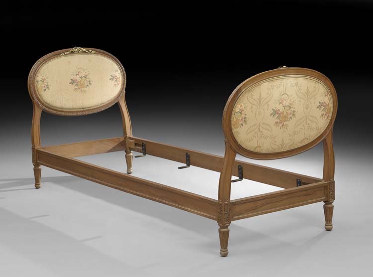 Louis XVI-Style Ormolu-Mounted Fruitwood Bedstead: Louis XVI-Style Ormolu-Mounted Fruitwood Bedstead, early 20th century, with matching upholstered oval headboard and footboard, h. 37", inside w. 26", inside l. 76", outside w. 30", outside l. 82".