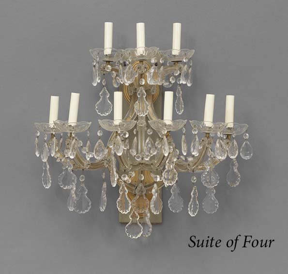 Set of Four Maria Theresa-Style Sconces: Set of Four Maria Theresa-Style Nine-Light Sconces, having scrolled glass candle branches hung with swags of prisms and glass drip pans, electrified and mounted to a backboard, h. 24", w. 21-1/2", d. 