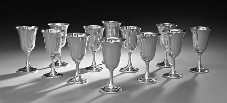 Twelve American Sterling Silver Water Goblets: Set of Twelve American Sterling Silver Water Goblets, mid-20th century, by Wallace Silversmiths, Wallingford, Connecticut, each with an inverted bell-form bowl, waisted stem and shallow ogee-domed bas