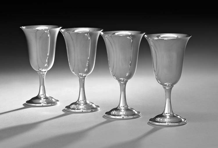 Four American Sterling Silver Water Goblets: Set of Four American Sterling Silver Water Goblets, mid-20th century, by Wallace Silversmiths, Wallingford, Connecticut, each with an inverted bell-form bowl, and trumpeting stem to an ogee-domed foot