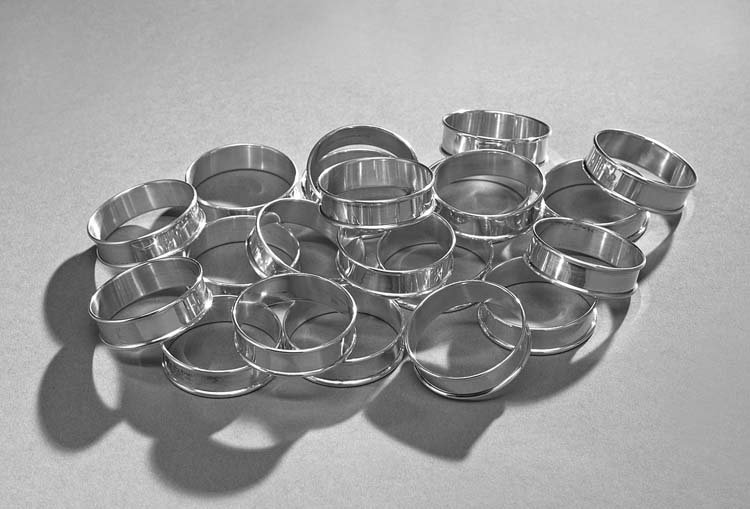 Twenty-One Gorham Sterling Silver Napkin Rings: Assembled Set of Twenty-One Gorham Sterling Silver Napkin Rings, mid-20th century, Providence, Rhode Island, of narrow band form, eight monogrammed "L", one inscribed "Rudolph Schuyler Kimball", twelv