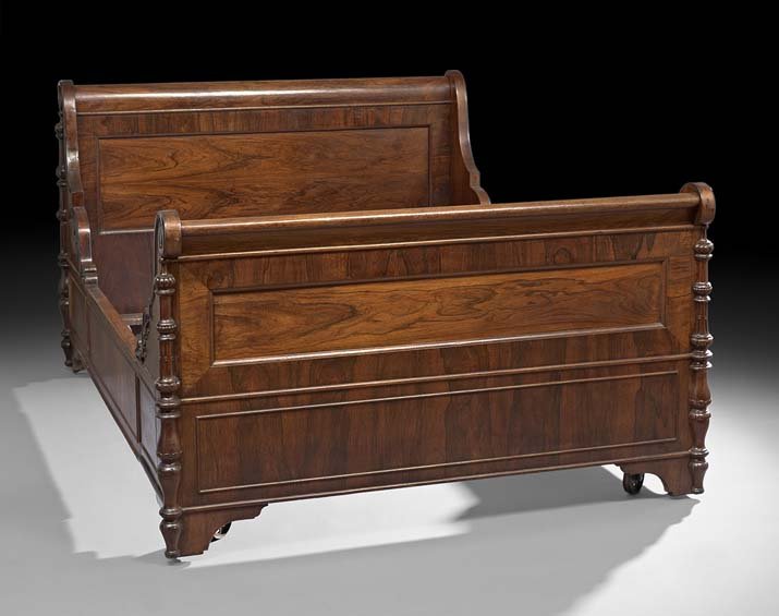 American Rococo Revival Rosewood Bedstead: American Rococo Revival Rosewood Bedstead, third quarter 19th century, in the manner of John Henry Belter or Alexander Roux, New York, the headboard and footboard of sleigh form and joined by short pa