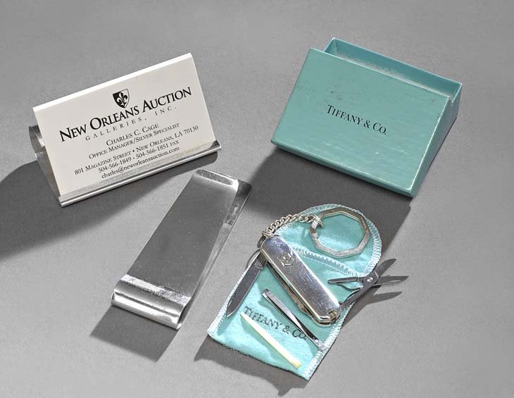 3 Tiffany & Co. Sterling Silver Desk Accessories: Three Tiffany & Co. Sterling Silver Desk Accessories, contemporary, including a desk clip, l. 4", a business card holder, w. 3-1/2", and a Swiss Army knife, l. 2-1/4", the latter with keyring chain an